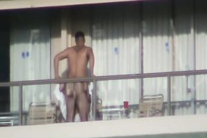 Spy clip of beefy muscular guy fucking excited black cock sluts on a balcony