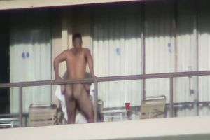 Spy clip of beefy muscular guy fucking excited black cock sluts on a balcony