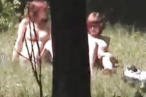 I spied and filmed two nudist babes in the woods all stripped sunbathing