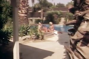 Two sexy blondes are having enjoyment with this moustached chap by the pool