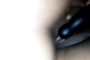 My horny white wife rubs her clitoris with a toy during the time that I fuck her creamy bawdy cleft