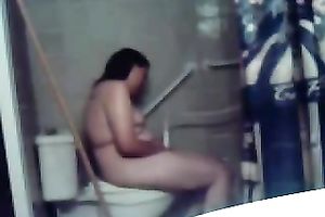 My concupiscent overweight dark brown wife masturbates her fur pie on the latrine bowl