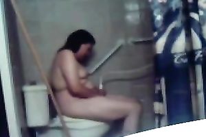 My concupiscent overweight dark brown wife masturbates her fur pie on the latrine bowl