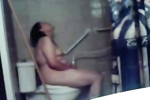 My concupiscent overweight dark brown wife masturbates her fur pie on the latrine bowl