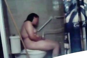 My concupiscent overweight dark brown wife masturbates her fur pie on the latrine bowl