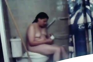 My concupiscent overweight dark brown wife masturbates her fur pie on the latrine bowl