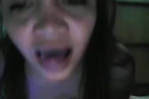 Webcam scene with aged Filippina fingering her muff