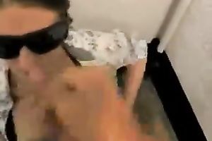 Girlfriend wears dark sunglasses and waits to be facialized