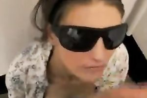 Girlfriend wears dark sunglasses and waits to be facialized