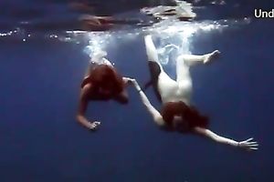 Naughty legal age teenager babes feel playful and luscious underwater