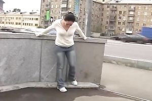 Just an amateur dark brown playgirl in jeans peeing in her panties in public