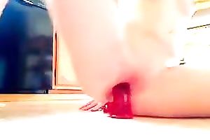 Well shaped floozy masturbating with big sex toy in the kitchen