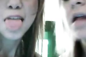 Tight and youthful web camera lesbies diddle every other's snatches for me