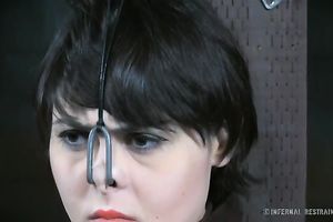 White wench chained to the post in sitting position