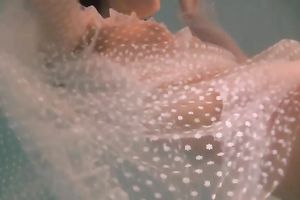 Sensational and juvenile dark brown chick in white dress undrewater