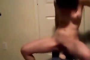 Slender white playgirl trying to ride a dildo on the chair