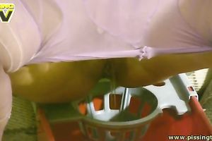 Slim titless pale brunette hair takes off hose to pee into the bucket