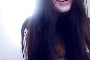 Exclusive dark brown diminutive babe shows up topless on cam