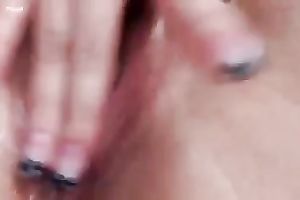 Stunning beauty with large mambos caresses her vagina with fingers