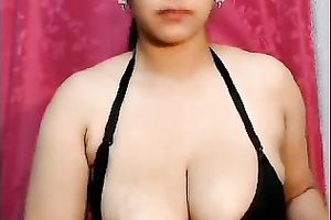 Exotic looking playgirl shows off soaked jugs on livecam