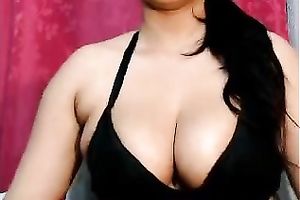 Exotic looking playgirl shows off soaked jugs on livecam