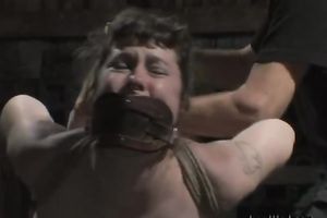 Brown-haired milf receives bound up and tortured in a basement