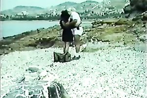 Classic brunette hair with petite bra buddies blowing wang on the beach