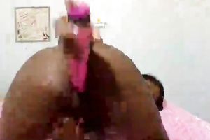 Skinny and lascivious ebon doxy dildoing herself on cam