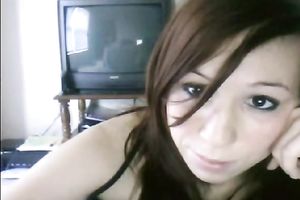 Redhead cutie is bored in the guest room and flashes privates on cam