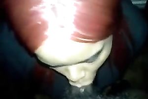 Red haired black skinned blowlerina kneels down to suck my buddy's BBC