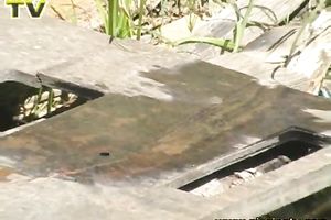 Looking like an alien pale redhead in yellow suit voids urine outdoors