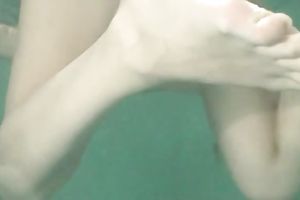 Slender recent Russian cutie plays with her pussy underwater