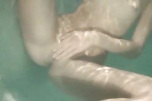 Slender recent Russian cutie plays with her pussy underwater