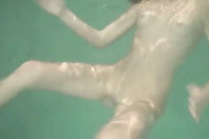 Slender recent Russian cutie plays with her pussy underwater
