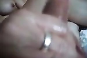 My sexually excited girlfriend oils up my ramrod and jerks it off