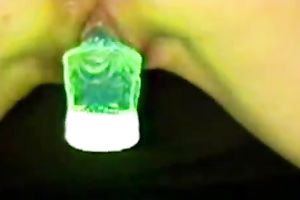 Slender white black cock slut uses glowing stick for masturbation