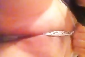 Playing with my muff by rubbing and fingering it through her pants