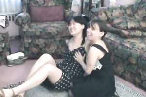 Two nerd women in dark attires take a part in a trio