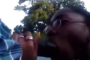 Four eyed swarthy sweetheart doesn't mind engulfing a weenie in public