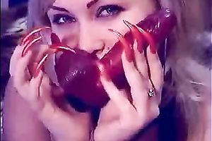 Auburn MILFie nympho with red nails took a dildo to have joy on livecam