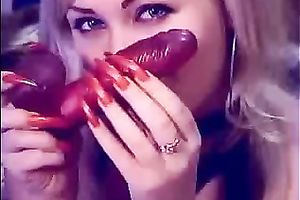 Auburn MILFie nympho with red nails took a dildo to have joy on livecam