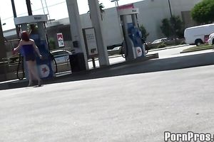 Sassy redhead golddigging bimbo pumping gas in her bimmer