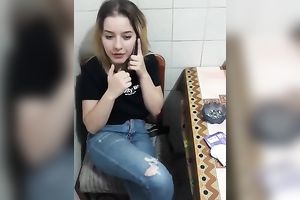Wife sucks her while she talks to her husband on the phone.