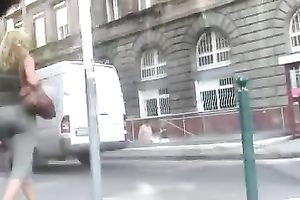 Sexy playgirl in tight trousers walking down the streets