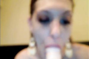 Brown-haired cutie sucks a sex toy previous to poking it in her pussy