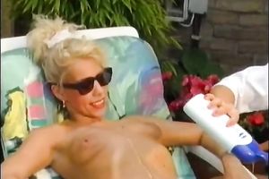 Skinny golden-haired slutty wife gets her body oiled up outdoors