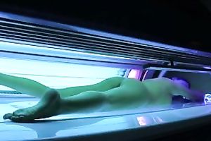 Perfect breasty dark brown hottie in the solarium naked on hidden camera