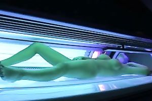 Perfect breasty dark brown hottie in the solarium naked on hidden camera