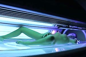 Perfect breasty dark brown hottie in the solarium naked on hidden camera