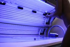 Perfect breasty dark brown hottie in the solarium naked on hidden camera